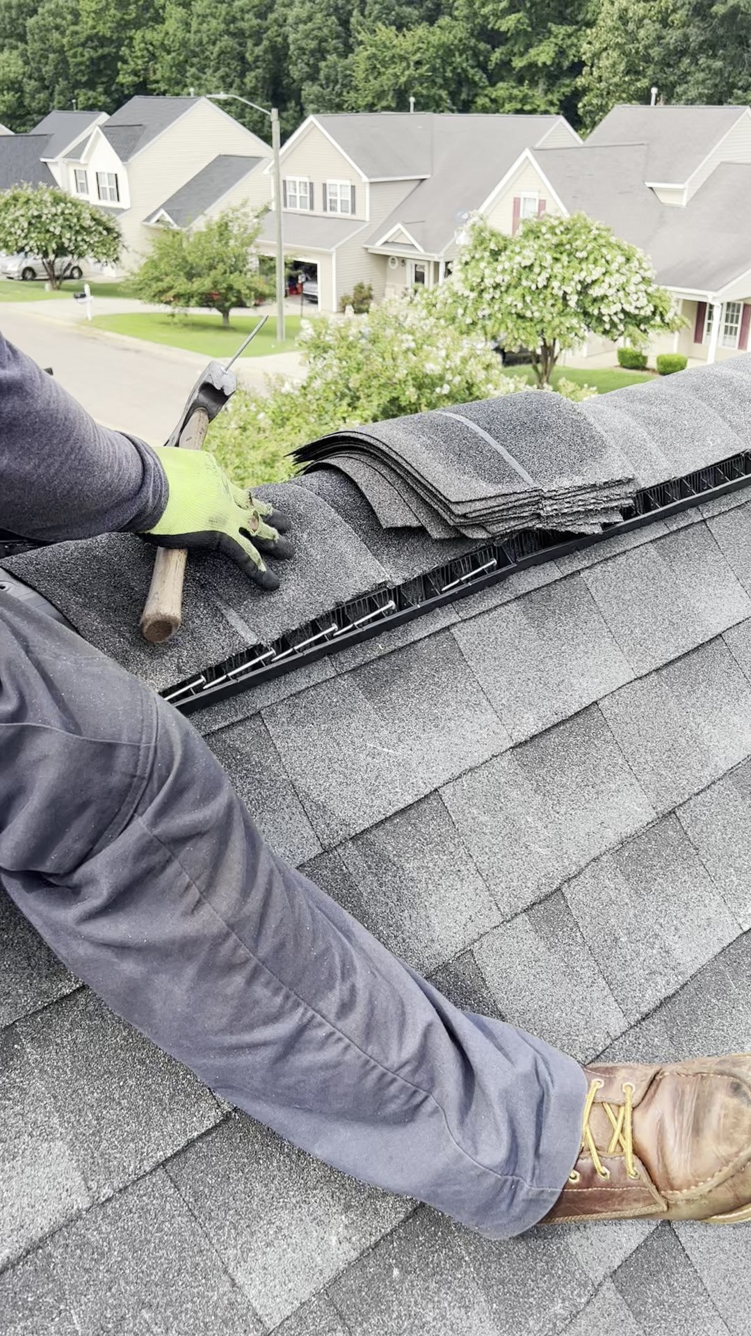 Close view of ridge-cap work on a shingle roof published in Sunset Roofing and Construction's project gallery