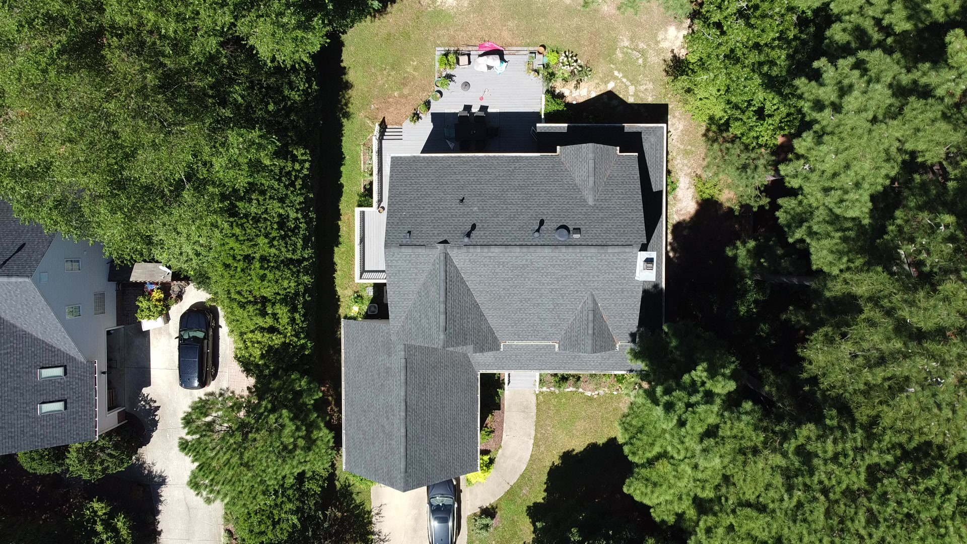 Aerial view of a residential roof published in Sunset Roofing and Construction's project gallery