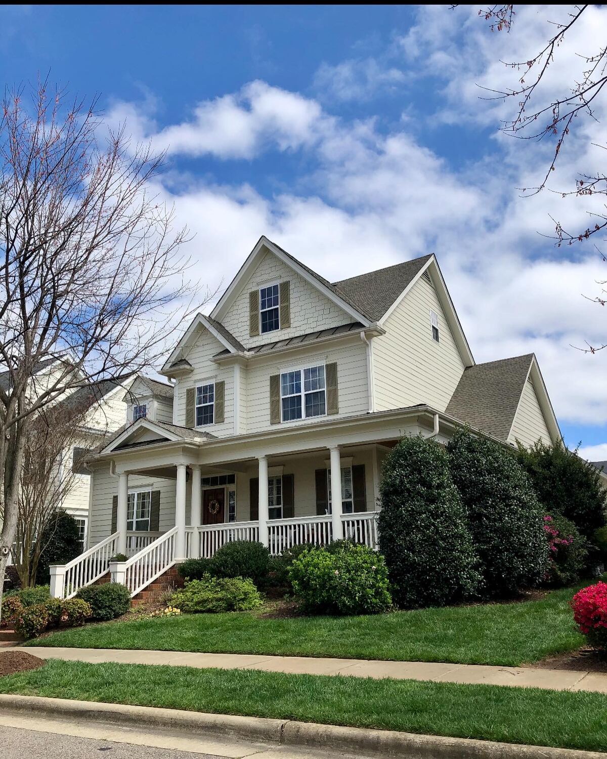 Two-story home with a newly installed shingle roof